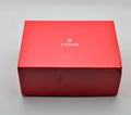 Tudor red outer presentation box with Tudor logo, closed