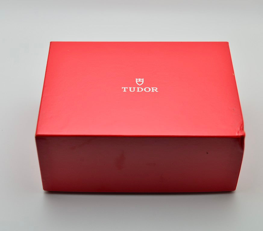 Tudor red outer presentation box with Tudor logo, closed