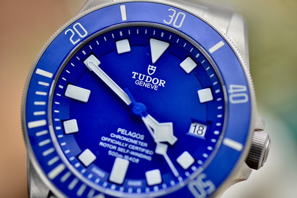 Tudor Pelagos 42 blue dial and ceramic bezel, angled close-up view showing luminous hour markers