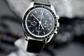 Omega Speedmaster Professional Moonwatch black dial and stainless steel case, angled close-up view
