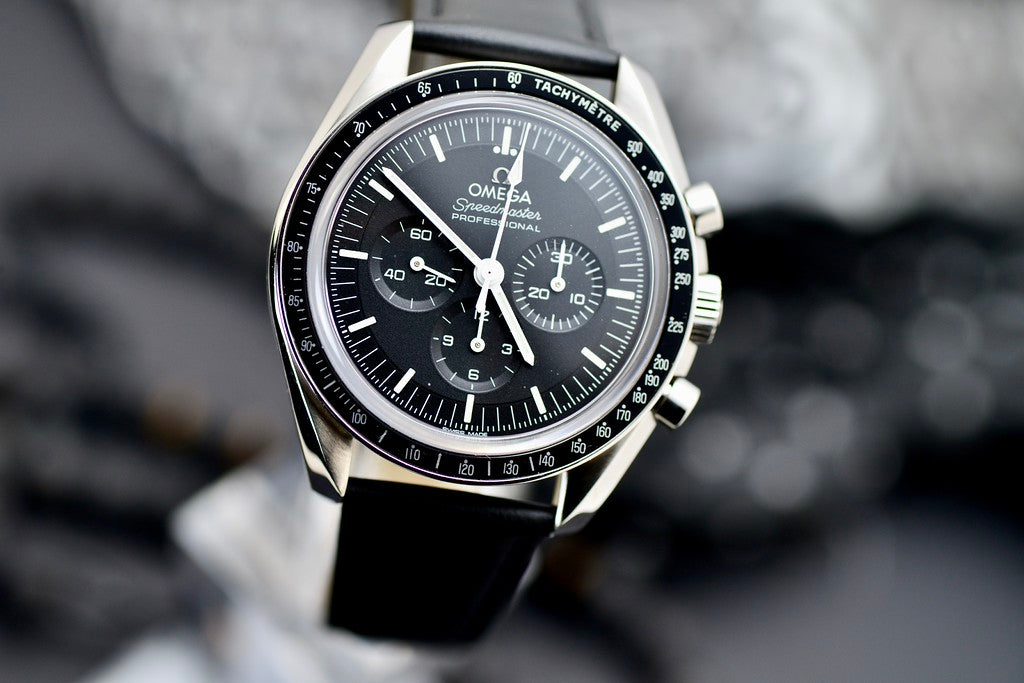 Omega Speedmaster Professional Moonwatch black dial and stainless steel case, angled close-up view