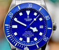Tudor Pelagos 42 blue dial close-up with titanium case, date window, and matte blue ceramic bezel