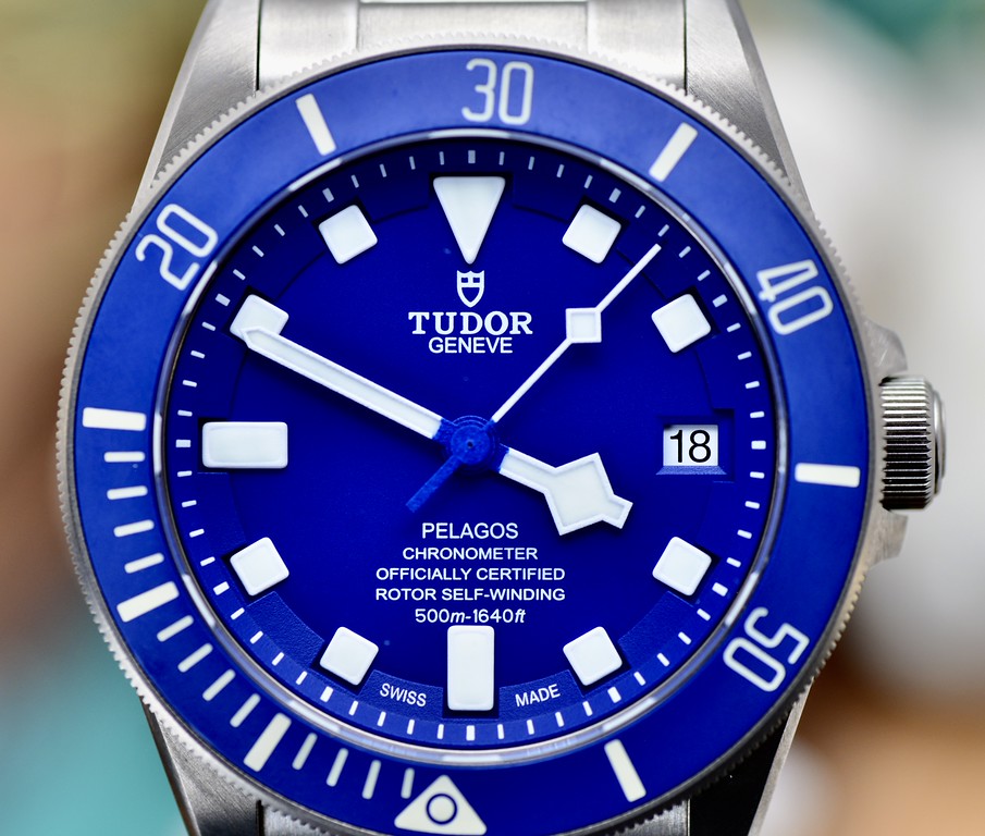 Tudor Pelagos 42 blue dial close-up with titanium case, date window, and matte blue ceramic bezel