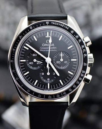 Omega Speedmaster Professional Moonwatch Co-Axial Master Chronometer 42mm stainless steel watch with black dial and black leather strap, front view