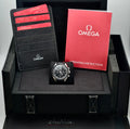 Omega Speedmaster Professional Moonwatch presentation box with Omega card holder, warranty cards, and operating instructions booklet